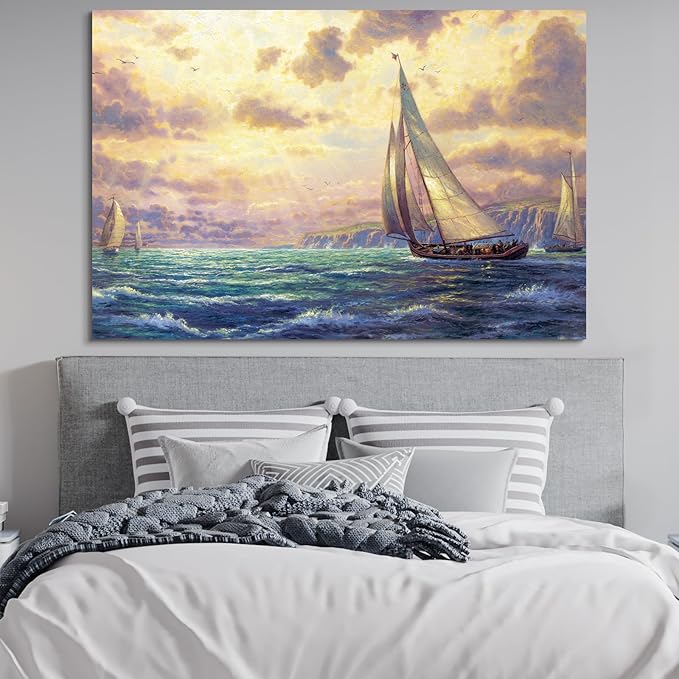STUDIO HAVEN Thomas Kinkade Canvas Wall Art, Ocean Sailboats Golden Sunset Rushing Waves and Coastal Cliffs Oil Painting Poster Nautical Wall Decor, Framed Prints for Home Decor, 28x20Inch