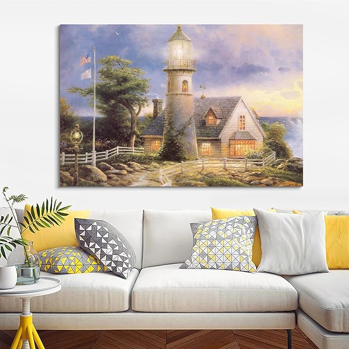 STUDIO HAVEN Thomas Kinkade Canvas Wall Art, Lighthouse Cottage Beacon with American Flag White Fence Ocean Sunset Oil Painting Poster Coastal Wall Decor, Framed Prints for Home Decor, 28x20Inch