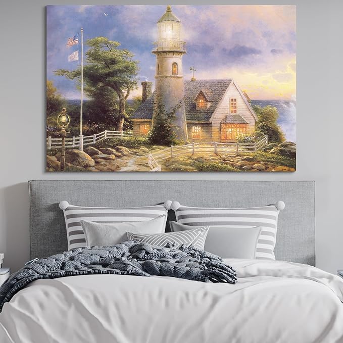 STUDIO HAVEN Thomas Kinkade Canvas Wall Art, Lighthouse Cottage Beacon with American Flag White Fence Ocean Sunset Oil Painting Poster Coastal Wall Decor, Framed Prints for Home Decor, 36x24Inch